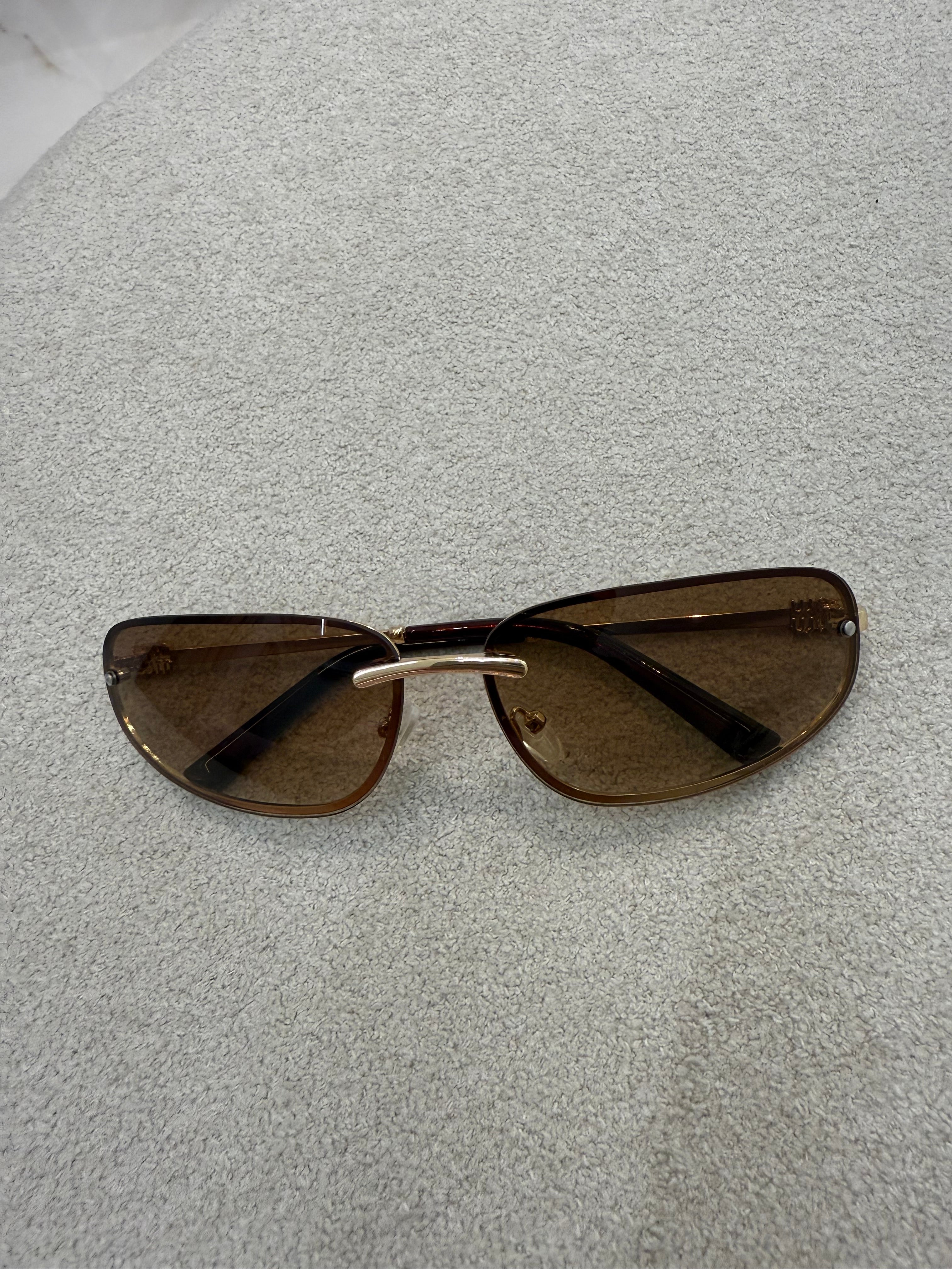 Óculos Miu Miu 043