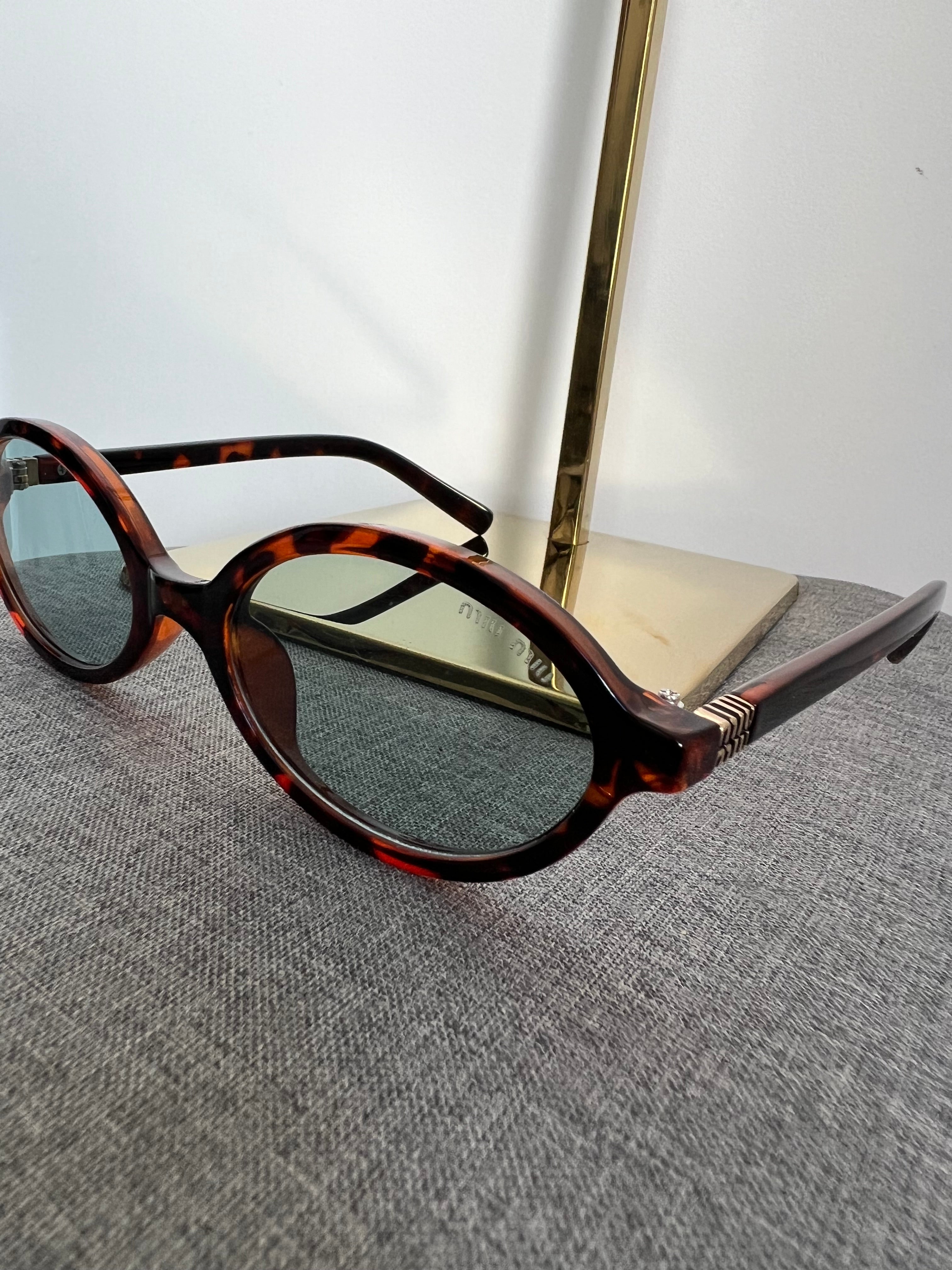 Óculos Miu Miu 6